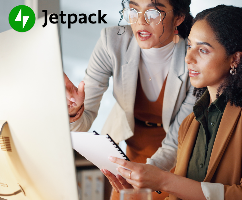 two women reviewing fonts on a desktop